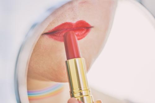 Closeup of female lips with red lipstick reflected in mirror Lifestyle Luxury Elegant Style Beautiful Face Cosmetics Make-up Lipstick Decoration Mirror