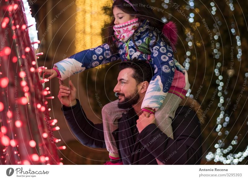 Look lights! Lifestyle Winter Decoration Child Human being Man Adults Father Family & Relations Tree Touch Carrying Together Emotions Daughter christmas City
