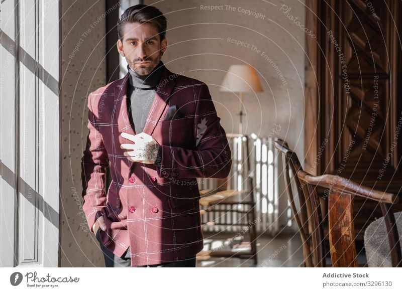 Serious confident elegant man looking at camera in country house businessman jacket vintage groomed contemplate pensive classy serious stylish interior retro