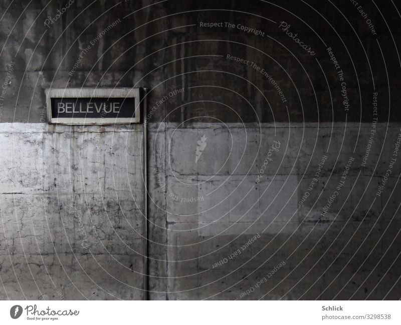 bellevue Architecture Wall (barrier) Wall (building) Underground Concrete Characters Signs and labeling Signage Warning sign Dirty Dark Brown Gray Esthetic