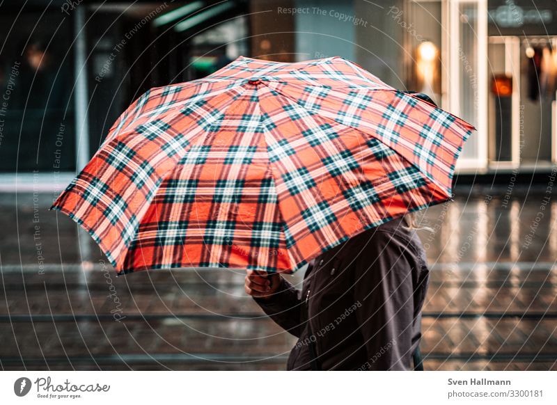 UmBRelLA Human being Feminine Woman Adults Hand 1 18 - 30 years Youth (Young adults) Bad weather Rain Town Downtown Jacket Umbrella Going Red Colour photo