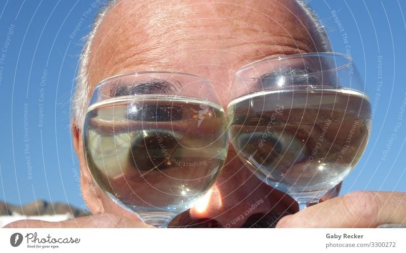 Eyes through the wine glass Human being Masculine Man Adults Life Head 1 45 - 60 years Moody Joy Happiness Cool (slang) Funny Colour photo Exterior shot