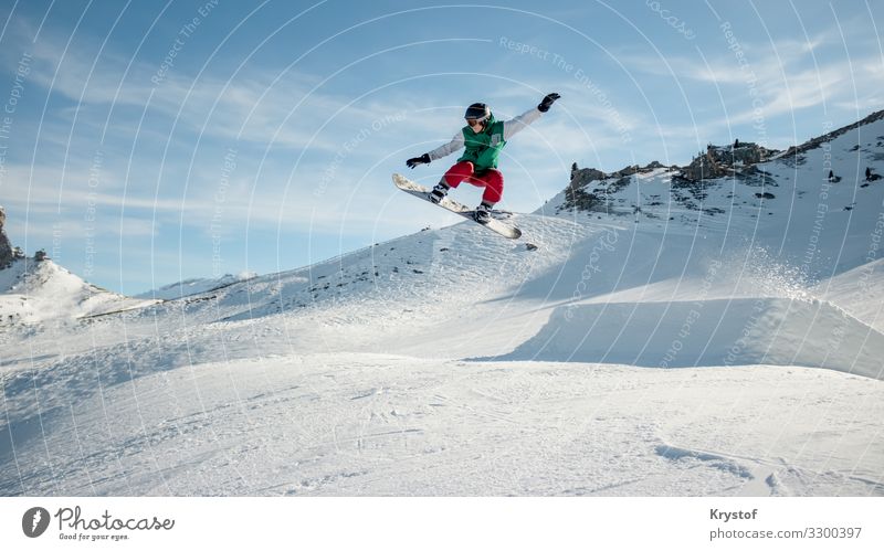 Jumping snowboarder Sports Snowboard Nature Ice Frost Moody Alps Austria Winter Colour photo Exterior shot Day Wide angle Forward