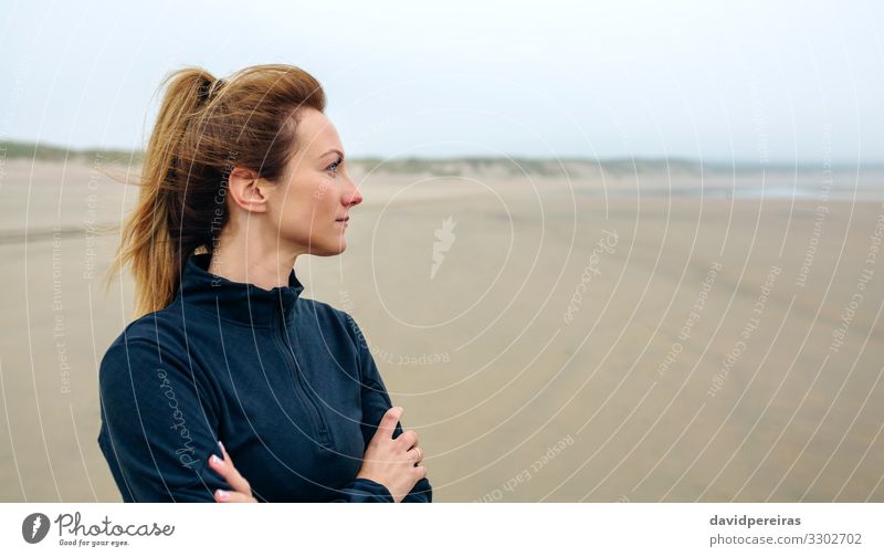Woman looking at sea Lifestyle Beautiful Meditation Beach Ocean Human being Adults Sand Autumn Fog Think Smiling Authentic Serene Loneliness Future positive