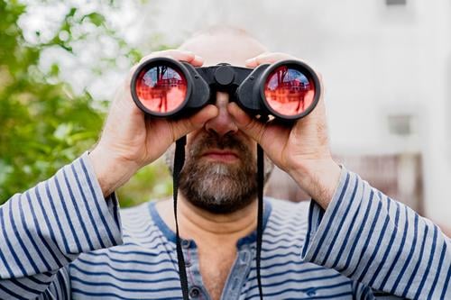 Man looks through binoculars into the distance Human being Masculine Adults Observe Discover Expectation Inspiration Problem solving Curiosity Perspective