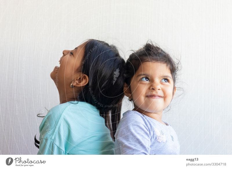 Two little girls looking at each other Lifestyle Joy Happy Face Child School Schoolchild To talk Human being Feminine Baby Toddler Girl Sister