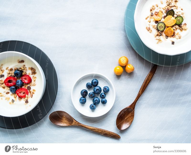 Healthy breakfast with yoghurt, muesli and fruits Food Yoghurt Fruit Grain Cereal Oat flakes Raspberry Blueberry Nutrition Breakfast Diet Plate Bowl Spoon