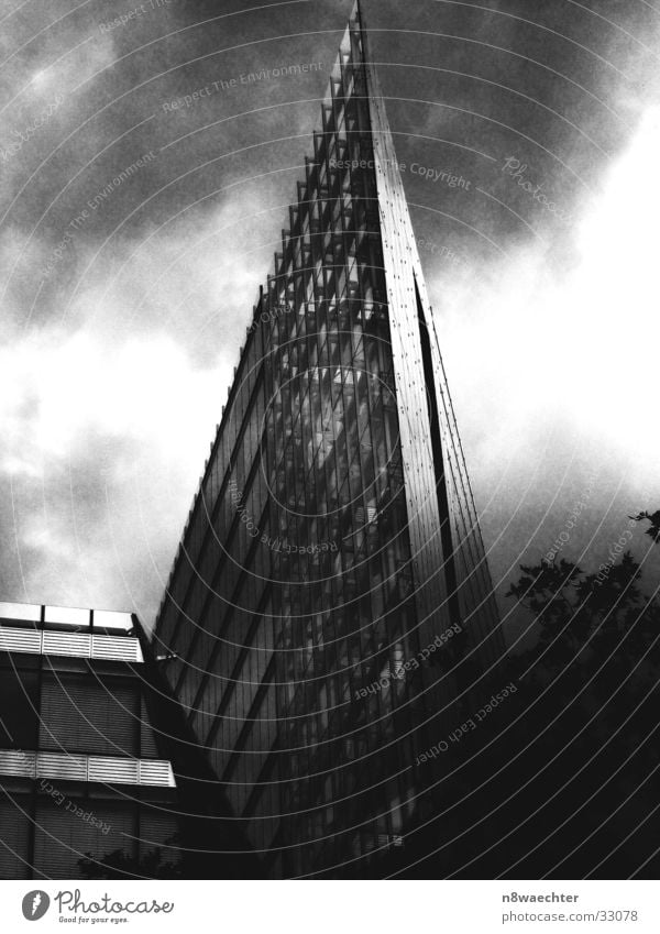 Modern Office High-rise Triangle Steel Grid Black White Dark Clouds Gritty Flat Architecture building Glass Shadow Black & white photo Berlin annexes Tall