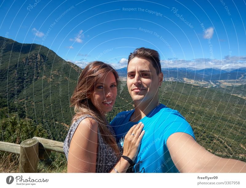 Couple taking a selfie in the Nature Lifestyle Joy Happy Vacation & Travel Trip Hiking Telephone PDA Camera Human being Young woman Youth (Young adults)