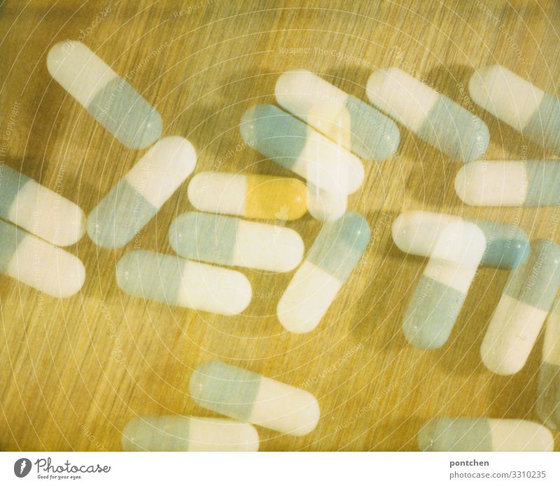 Polaroid shows capsule-shaped drugs Lifestyle Considerate Threat To enjoy Healthy Health care Capsule Drinking Melt away Addiction Giddy Double exposure Poison