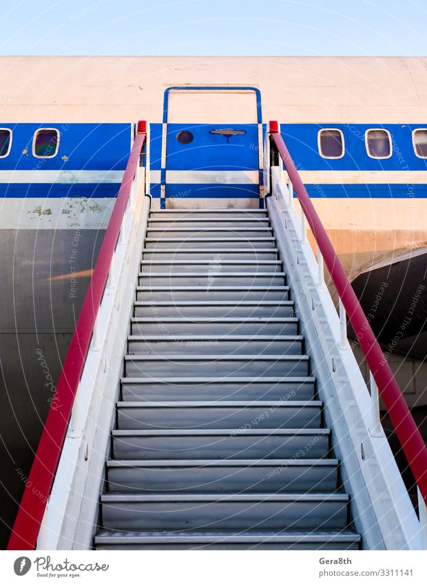 gangway of an old civilian airliner Vacation & Travel Aviation Transport Porthole Airplane Passenger plane Metal Steel Old Retro Speed Blue Red Colour door
