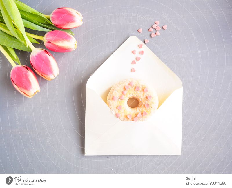 envelope with a donat, pink hearts and tulips Food Dough Baked goods Lifestyle Valentine's Day Mother's Day Wedding Birthday Examinations and Tests Mail Flower