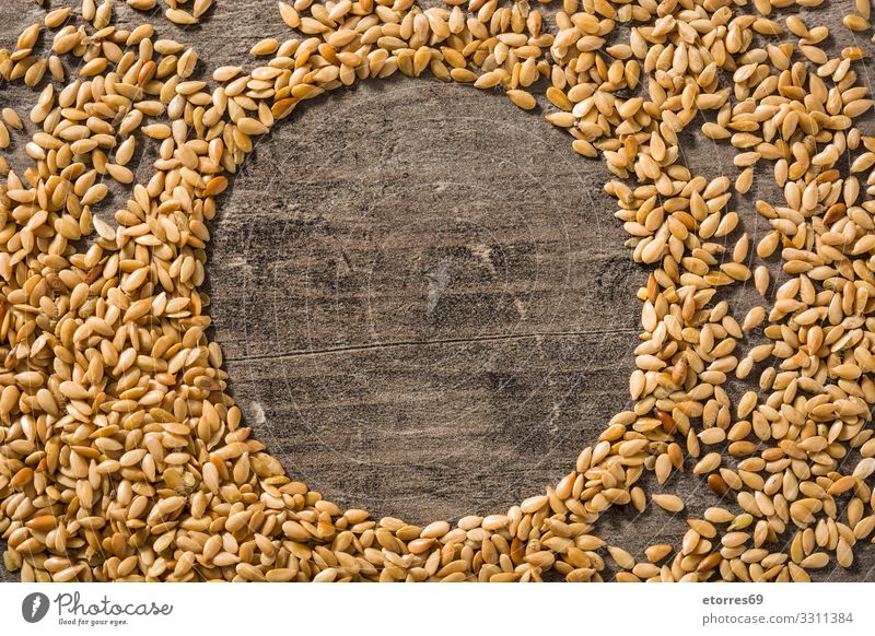 Golden flax seeds on wooden table. Copy space Flax Seeds Food Healthy Eating Food photograph Diet Ingredients Grain Exceptional Good Agriculture White Bowl