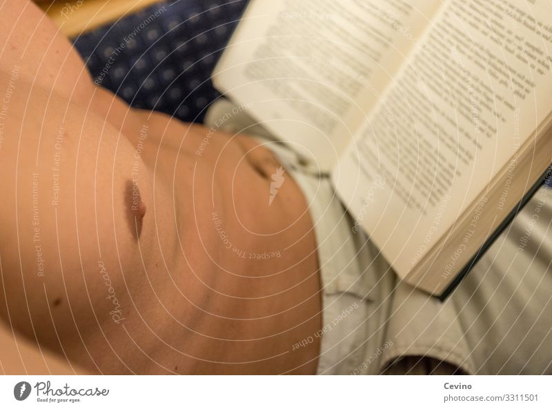 Reading time I Masculine Young man Youth (Young adults) Man Adults Chest 1 Human being 18 - 30 years Print media Relaxation Eroticism Upper body Pecs