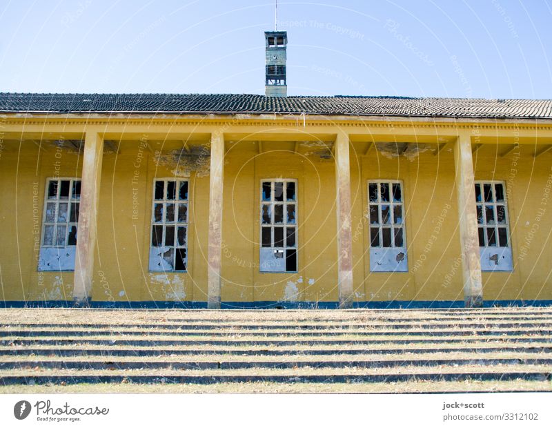 quietly lost Architecture Brandenburg Military building Sporting Complex Stairs Window Column Canopy Authentic Historic Yellow Secrecy Apocalyptic sentiment