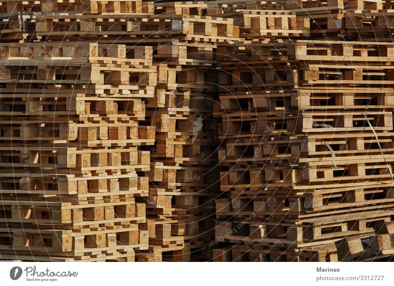 Stack of pallets outdoors. Work and employment Profession Factory Industry Transport Package Wood Society Industrial Warehouse background Consistency equipment