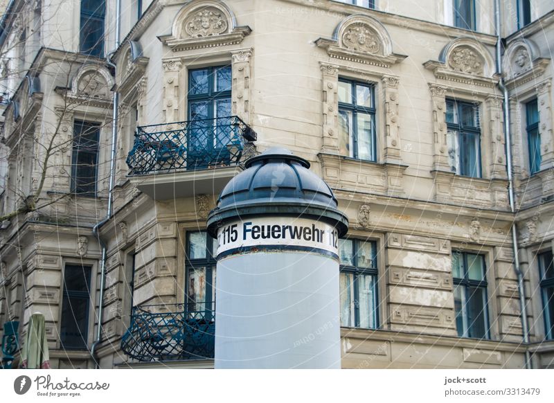 Fire department written on advertising pillar Advertising Industry Prenzlauer Berg Facade Balcony Window Advertising column Digits and numbers Signage Authentic