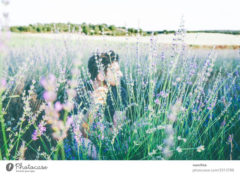 Young man in a field of flowers Face Relaxation Calm Sun Human being Masculine Man Adults 18 - 30 years Youth (Young adults) 30 - 45 years Environment Nature