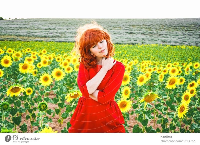 Lovely redhead woman enjoying the day in a field o sunflowers Lifestyle Style Joy Beautiful Freedom Summer Human being Feminine Young woman Youth (Young adults)