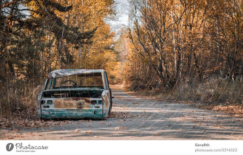 road with a broken car in Chernobyl Ukraine Vacation & Travel Tourism Trip Plant Sky Autumn Tree Leaf Transport Street Car Rust Old Threat Dangerous Colour
