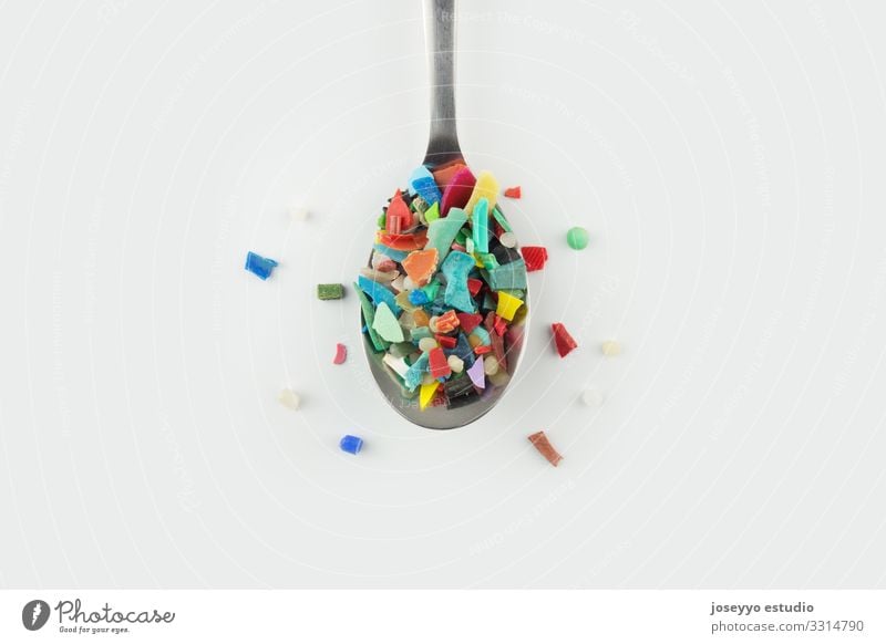 Spoon full of microplastics. Plastic pollution concept. Ocean Awareness Close-up Damage Destruction Earth Ecological Environment Family & Relations Food