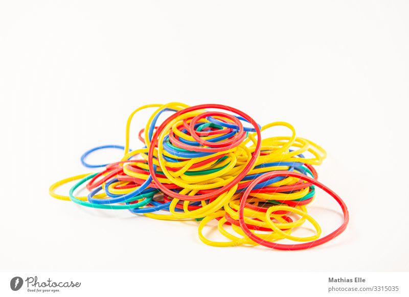 Coloured rubber bands elastic band Rubber Colourful rubber Blue Multicoloured Yellow Red Business Chaos Arrangement office Colour photo Studio shot Deserted