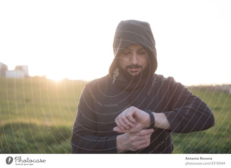 Bearded runner resting after training outdoors Lifestyle Happy Sports PDA Human being Man Adults Observe Fitness Mysterious Runner sportsman hood Arabia