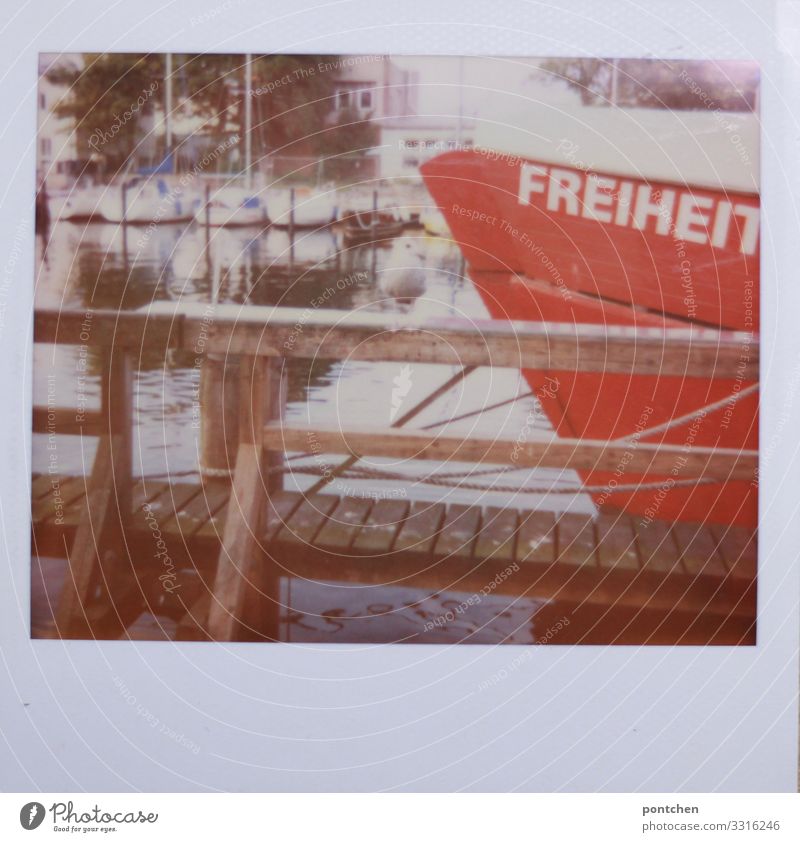Boat in the harbour with inscription Freiheit Leisure and hobbies Vacation & Travel Tourism Freedom Summer Ocean Waves Profession Captain Water Logistics