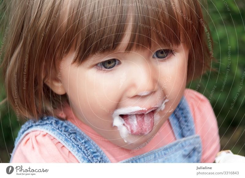 Baby are eating icecream with put out tongue Ice cream Eating Child Woman Adults Park Blonde White kid girl European Caucasian one two three Lady short hair