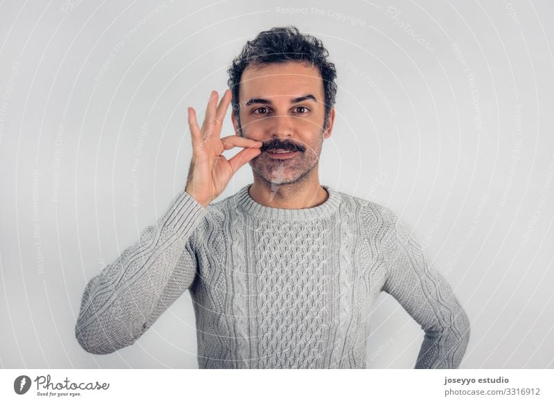 Brown, smiling, handsome man touching his mustache Adults Attractive Beauty Photography Cancer Casual clothes Cheerful Self-confident Copy Space Expression Face