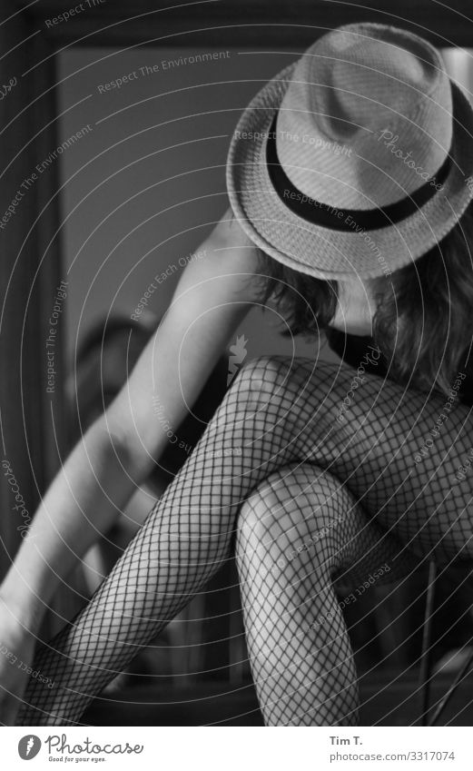 woman with hat Human being Feminine Woman Adults Arm Legs 1 Berlin Eroticism Hat Mirror Tights Black & white photo Interior shot Day Portrait photograph