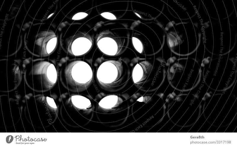 abstract dark background of round pipes Metal Dark Gloomy circle Geometry Hole Industrial iron light Monochrome Repeating Technical Black & white photo Abstract