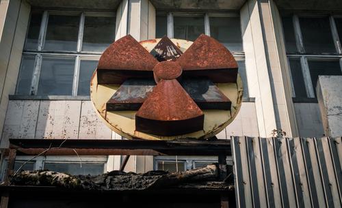 radioactive symbol on the facade of the building in Chernobyl Vacation & Travel Tourism Trip Autumn Building Architecture Rust Old Threat Disaster