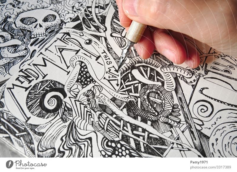 Detail of a hand drawing bizarre, surreal forms and structures with a  drawing pen into a sketchbook - a Royalty Free Stock Photo from Photocase