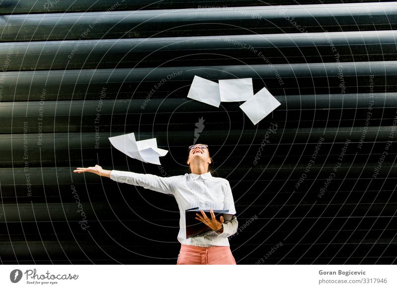 Young businesswoman throwing up paper documents outdoor Lifestyle Beautiful Success Work and employment Profession Business Human being Woman Adults Stand Throw