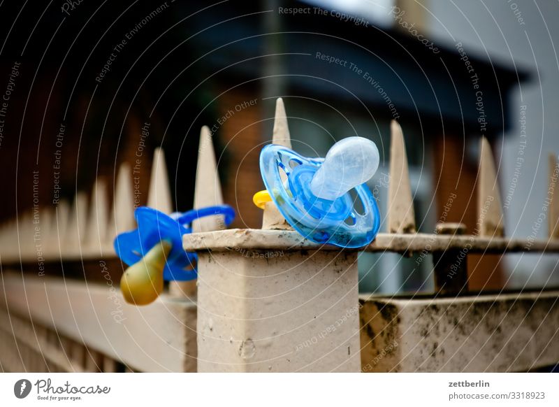 Two dummies Keep Baby Discovery site Find Real estate Child Kindergarten Toddler Soother suction cup Doomed Fence Border Boundary Deserted Copy Space