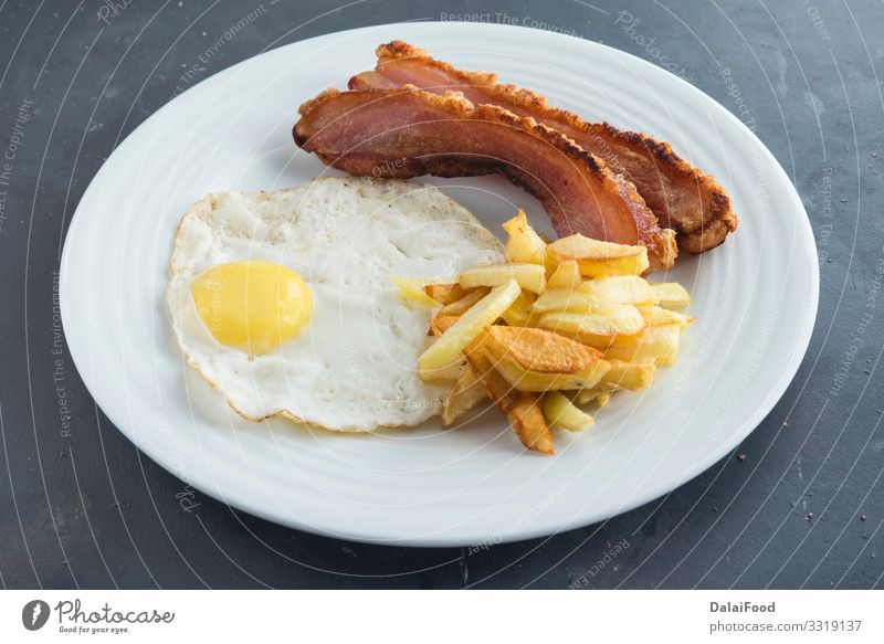 slice of bacon, egg and potatoes chips Breakfast Plate Diet Bacon black background food Potatoes Slice Spain spanish torrezno torreznos Colour photo