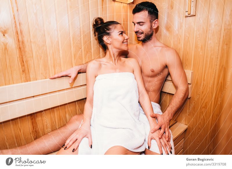 Young couple relaxing in the sauna Lifestyle Luxury Beautiful Body Skin Medical treatment Wellness Relaxation Spa Sauna Human being Young woman