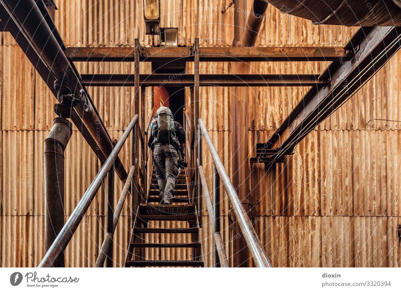 Unknown territories Adventure Human being Masculine Young man Youth (Young adults) 1 30 - 45 years Adults Industrial plant Ruin Steel factory Stairs Facade