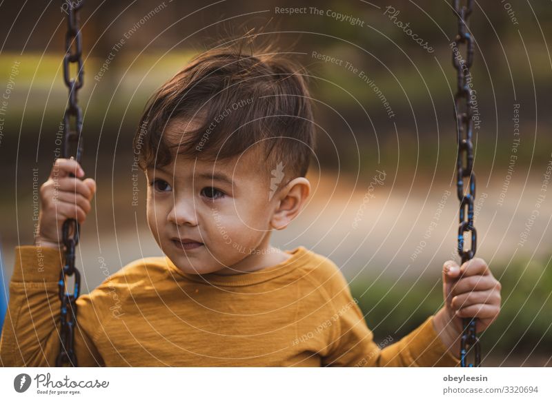 happy young boy playing outdoors in the park Human being Child Boy (child) 1 1 - 3 years Toddler Going Good Funny Colour photo Multicoloured Close-up Detail