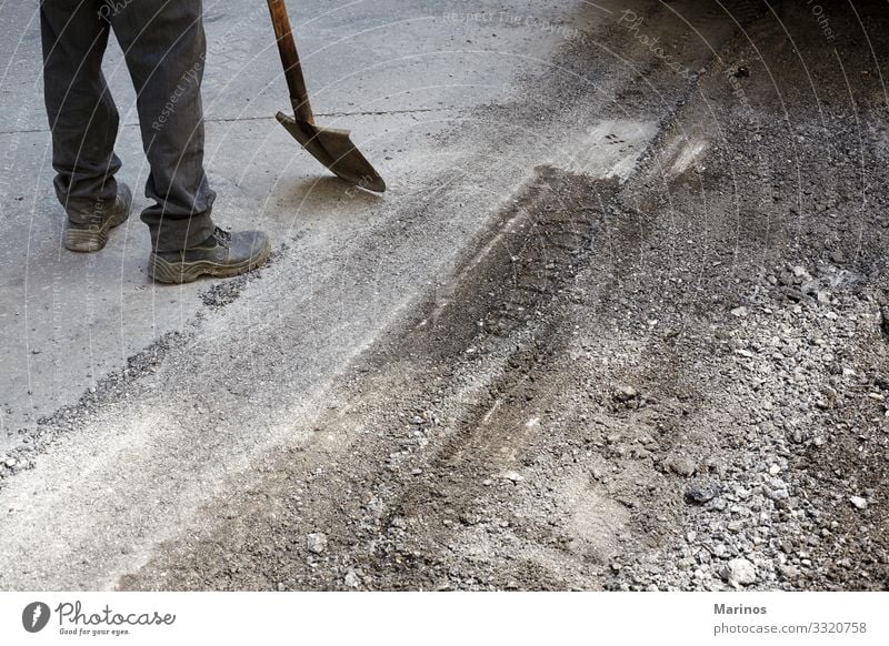 Worker using asphalt paver tool during road construction. Work and employment Industry Machinery Transport Street Highway Vehicle New Maintenance Asphalt
