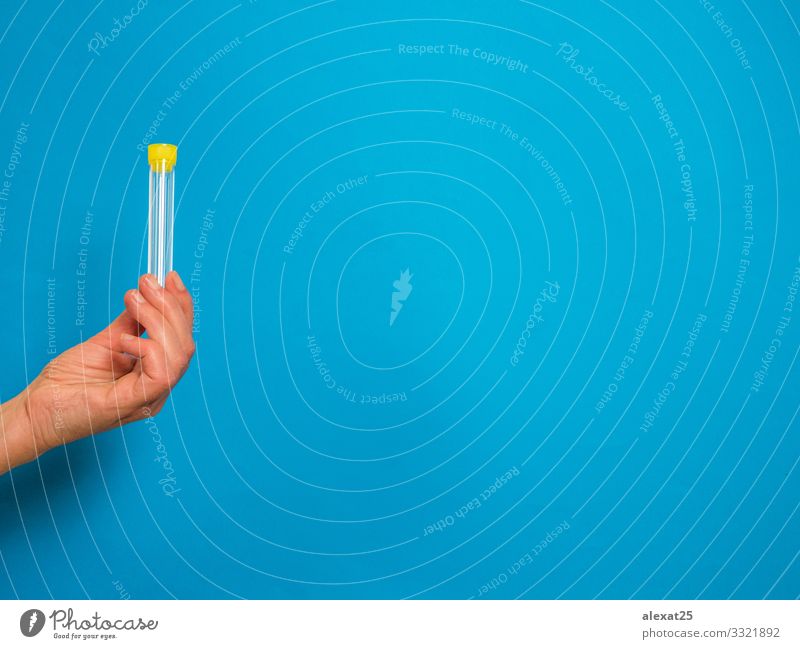 Hand with analysis tube on blue background with copy space Bottle Health care Illness Medication Science & Research Laboratory Examinations and Tests Container