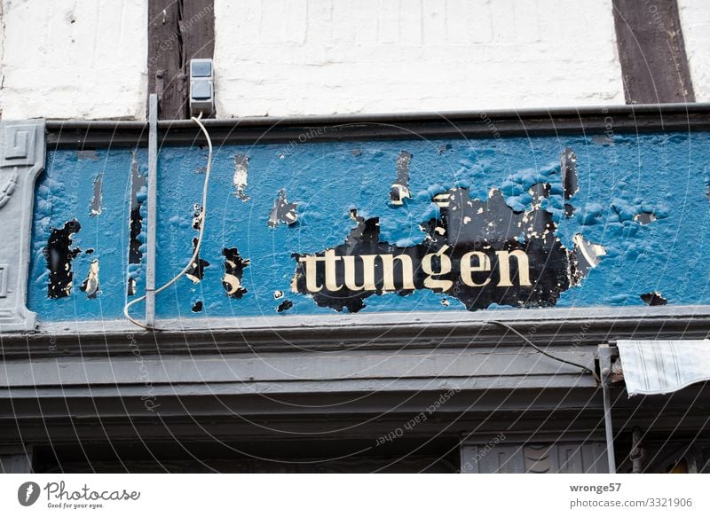 Old | mysterious advertisement above a shop topic day publicity Advertising shank Store premises puzzling indistinct built Facade Exterior shot Wall (building)