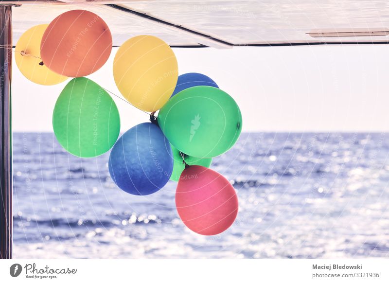 Colorful party balloons on a boat. Luxury Joy Happy Leisure and hobbies Vacation & Travel Trip Cruise Summer Summer vacation Ocean Waves Decoration
