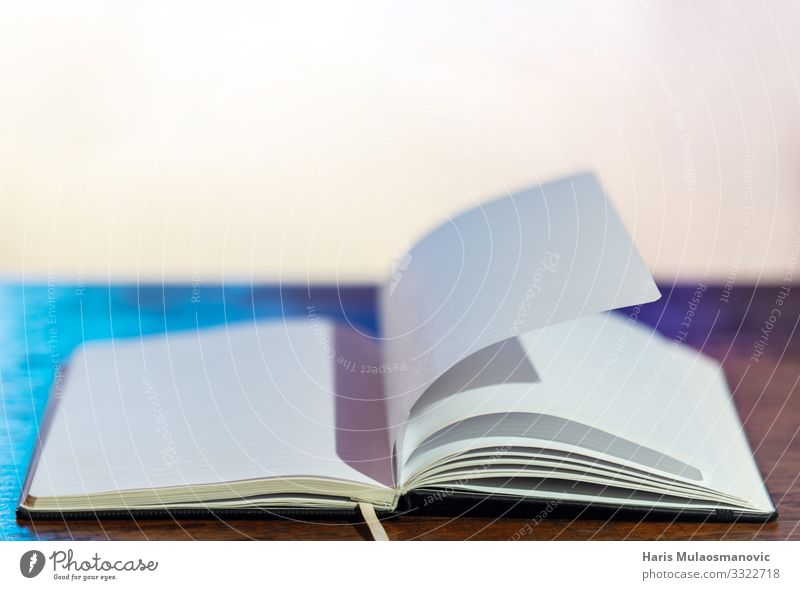 Empty book on the desk with blurry background - a Royalty Free