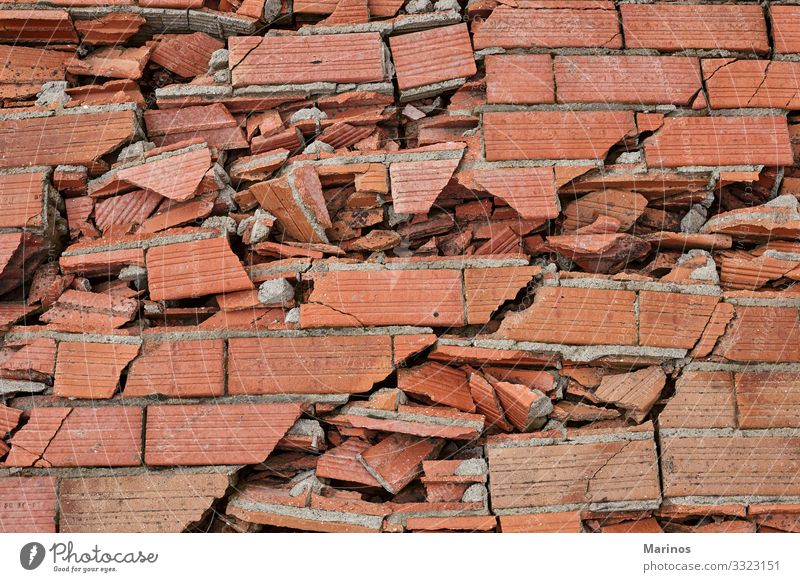 Broken brick wall as backgound. Building Architecture Stone Concrete Brick Old Dirty Red White Destruction broken Hole background Consistency Crack & Rip & Tear