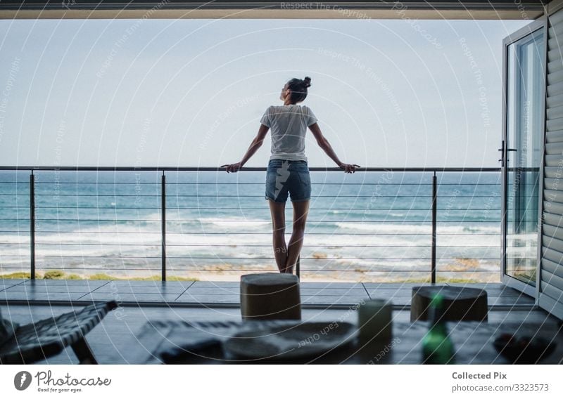 Woman standing on balcony looking over the ocean Lifestyle Elegant Design Joy Beautiful Wellness Well-being Contentment Relaxation Vacation & Travel Summer