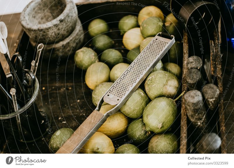 Limes in an industrial basket with grater Food Vegetable Fruit Crockery Bowl Lifestyle Healthy Feeding To enjoy Living or residing Esthetic Authentic Good