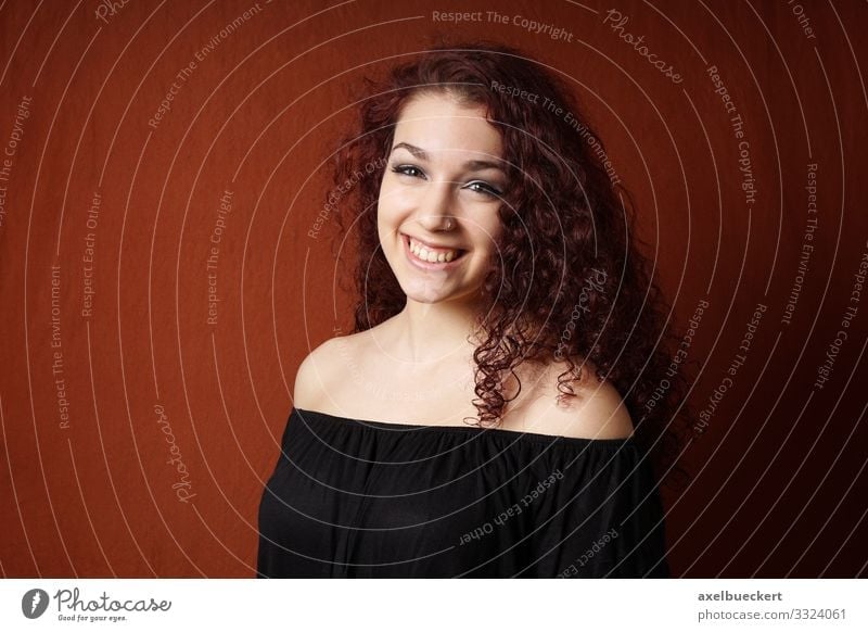 smiling young woman with curly hair Lifestyle Style Joy Beautiful Human being Feminine Young woman Youth (Young adults) Woman Adults 1 13 - 18 years