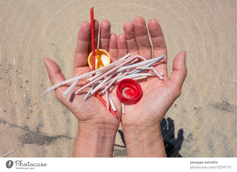 Hands full of plastics on the beach. Activist Awareness Beach care Clean Coast ears sticks Education Environment Free Future lollipops movement Ocean